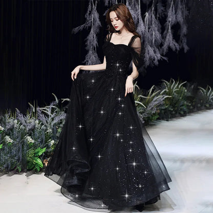 Black evening dress for women by MC THE BLACK DIAMOND, elegant sleeveless dress with a fitted silhouette and stylish design.