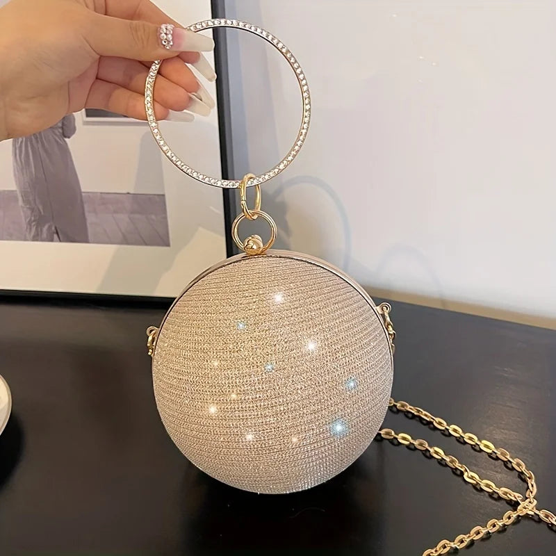 Black leather crossbody handbag with chain strap from MC The Black Diamonds, stylish and versatile for women.