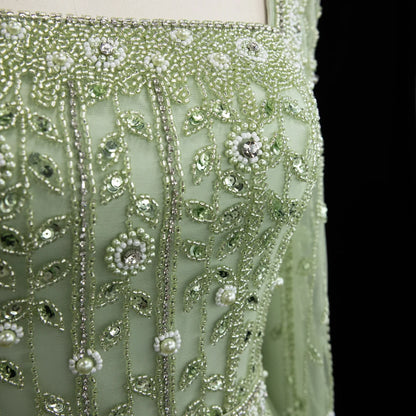 Elegant pink Dubai evening dress by MC THE BLACK DIAMOND featuring a flowing design and intricate detailing for formal occasions.