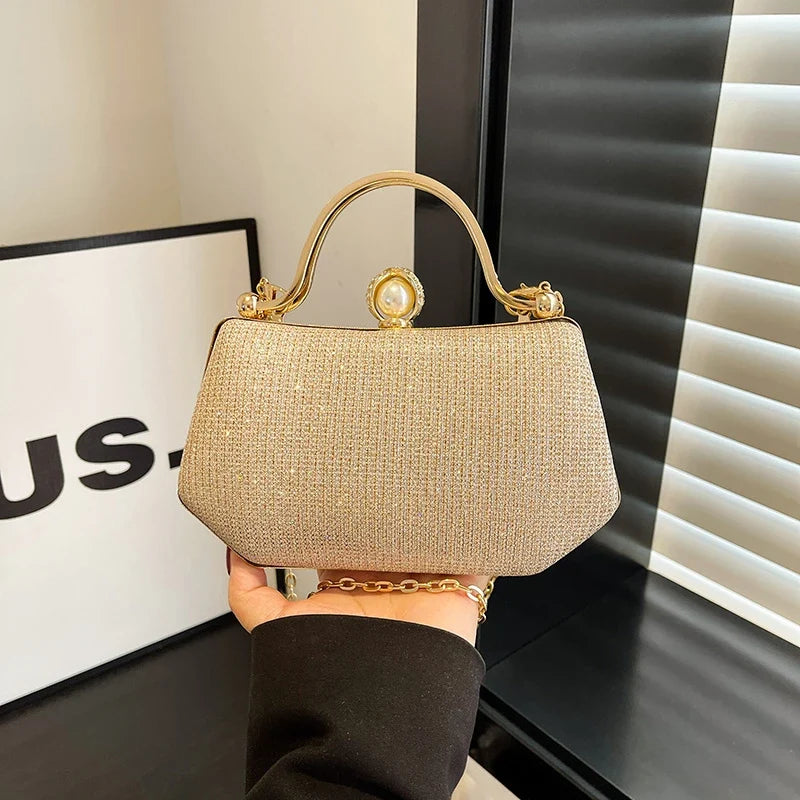 Black MC The Diamonds hand bag with solid color, chain strap, hasp closure, versatile simple crossbody design for women.