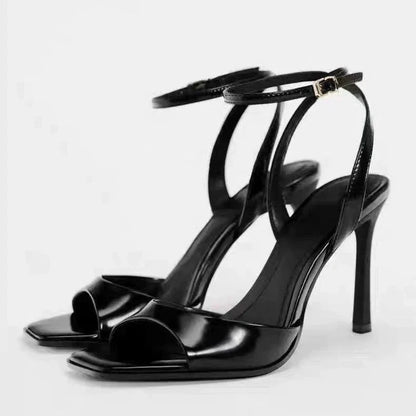 Gold patent leather ankle buckle high heel sandals for women by MC THE BLACK DIAMOND, featuring a sleek design and stiletto heel.