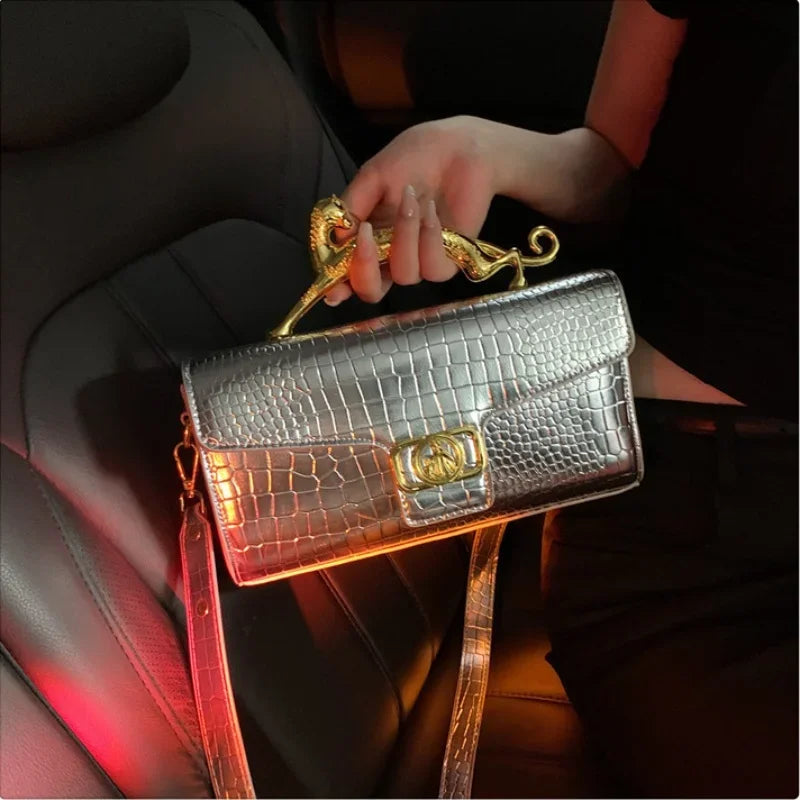 Women luxury leather hand bag by MC THE BLACK DIAMOND featuring a metal buckle, simple fashion design, shoulder style for parties.