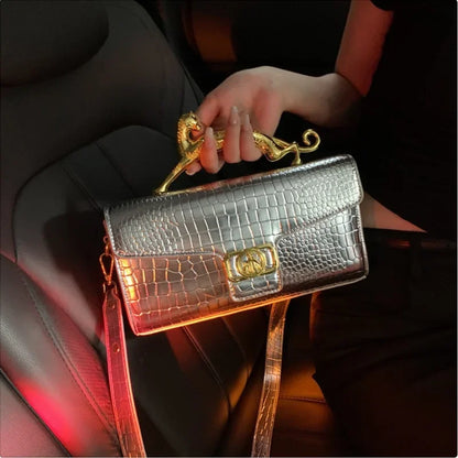 Women luxury leather hand bag by MC THE BLACK DIAMOND featuring a metal buckle, simple fashion design, shoulder style for parties.