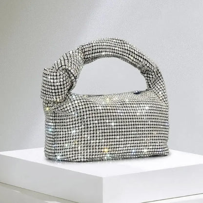 Silver crystal handle evening bag with rhinestone knot design, luxury MC THE BLACK DIAMOND designer purse for women.