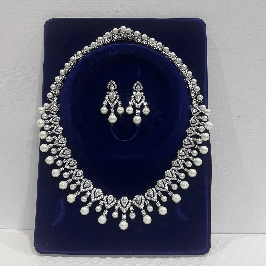 Elegant pearl necklace for women, showcasing a string of lustrous white pearls on a delicate jewelry chain.