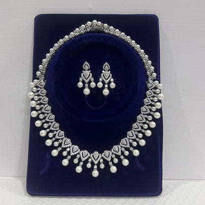 Elegant pearl necklace for women, showcasing a string of lustrous white pearls on a delicate jewelry chain.