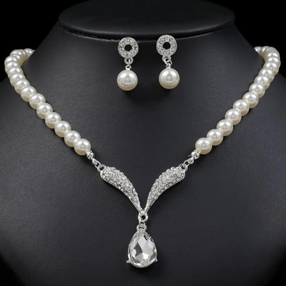 Gold jewelry set with pearl droplet necklace and matching earrings from Mohammad Collection, perfect for weddings and special occasions.