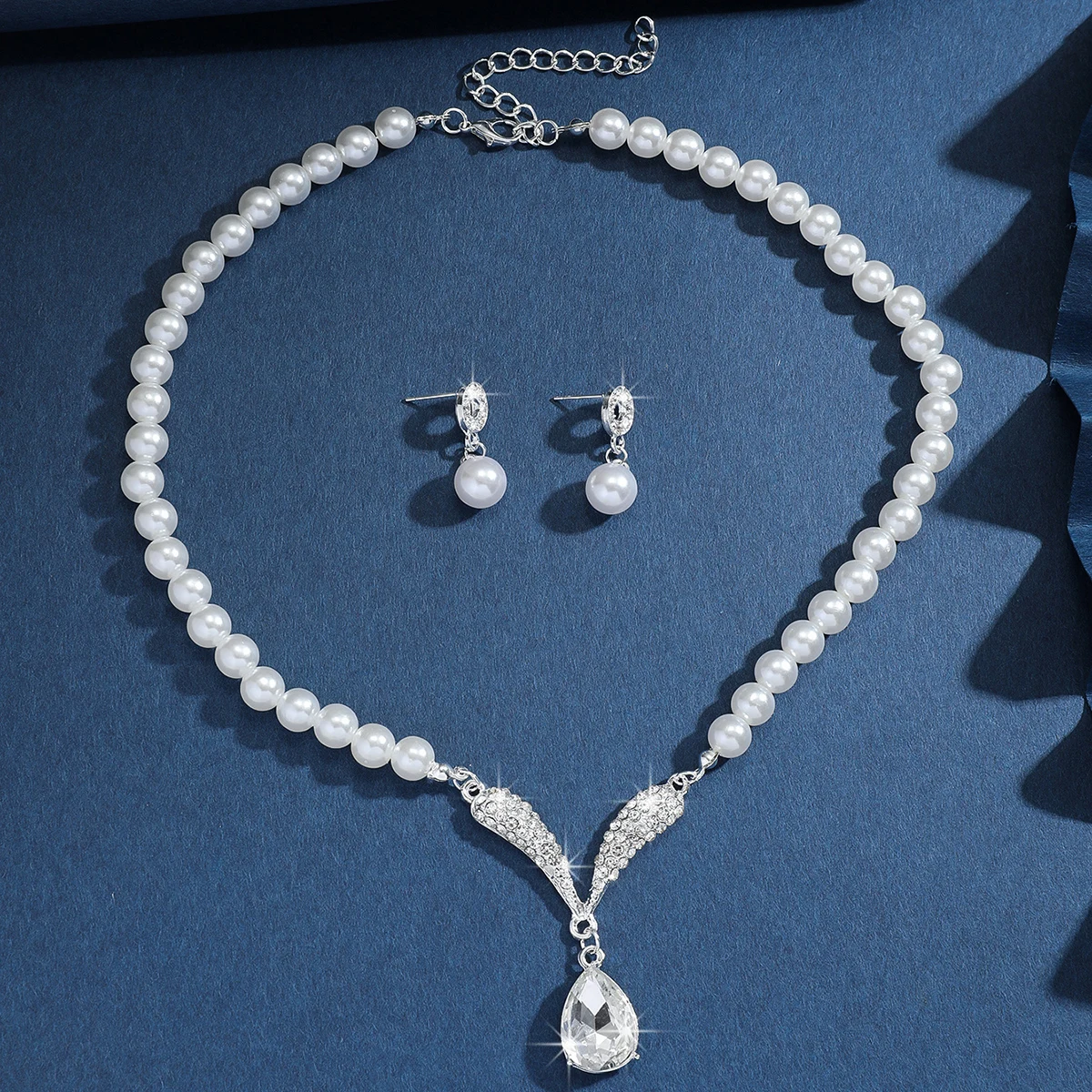 Mohammad Collection 3-piece pearl droplet necklace and earrings set in gold, perfect for weddings and special occasions.